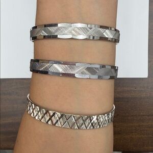 3 Silver tone bracelets